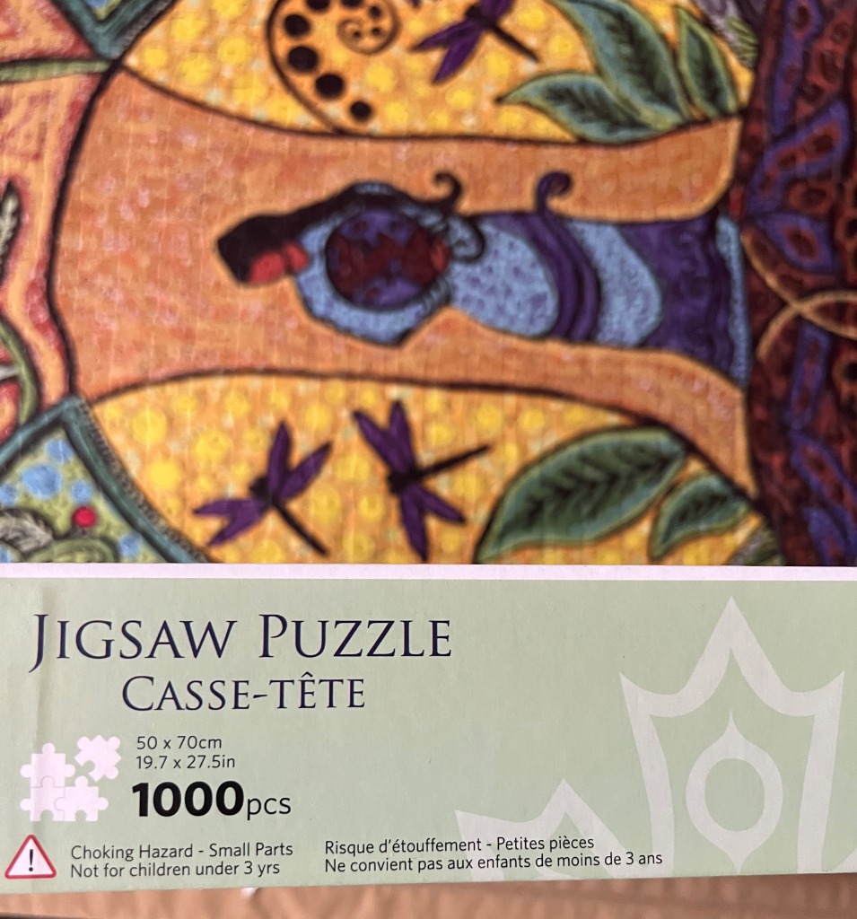 Stylized illustration featuring a dark-haired woman, a tree, and purple dragonflies against a golden background.