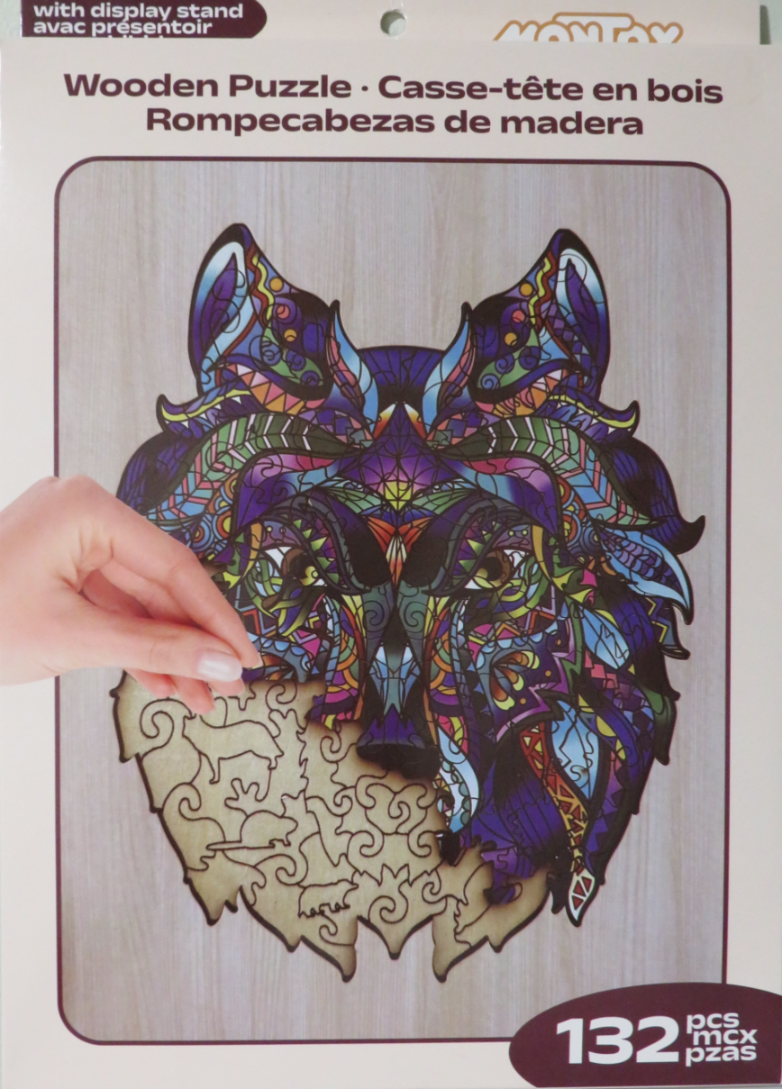 Stained-glass style wolf head illustration with intricate geometric patterns and vibrant colors.