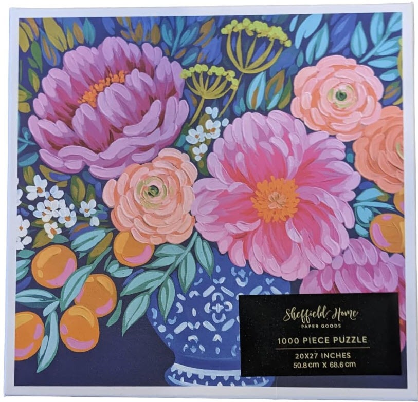 A lush, painted floral arrangement of pink and peach peonies in a blue and white patterned vase against a navy background.