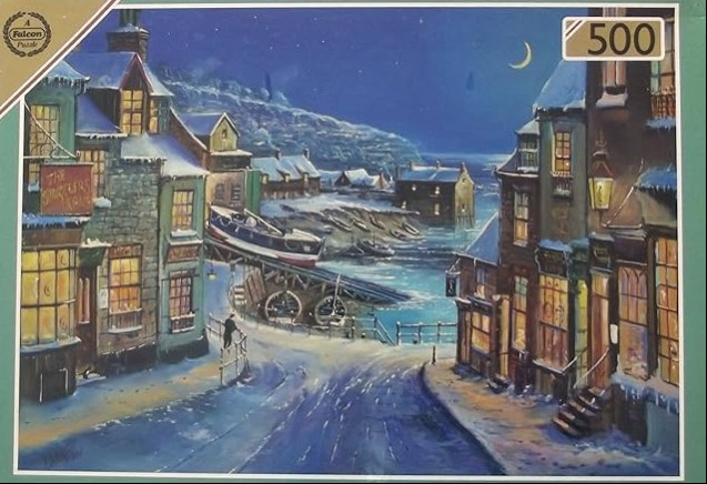 A peaceful snowy coastal village at night with a lifeboat station and glowing warm windows.