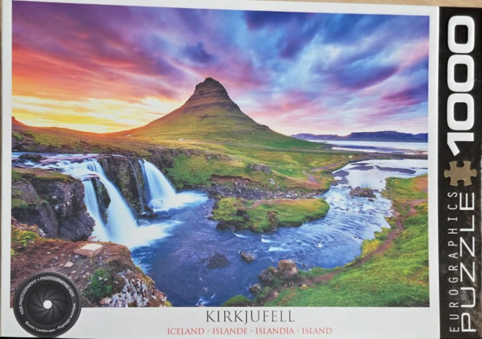 Photograph of Kirkjufell mountain in Iceland at sunset with waterfalls in the foreground.