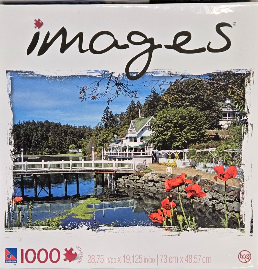 A sunny waterfront scene featuring a white building with a green roof, a footbridge, and vibrant red poppy flowers.