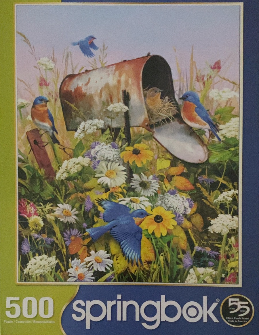 A painting of bluebirds nesting in a rusted mailbox surrounded by wildflowers.