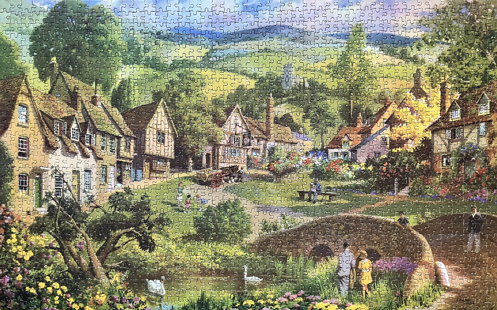 A pastoral English village scene featuring stone cottages, a small stone bridge, and a lush, blooming garden.