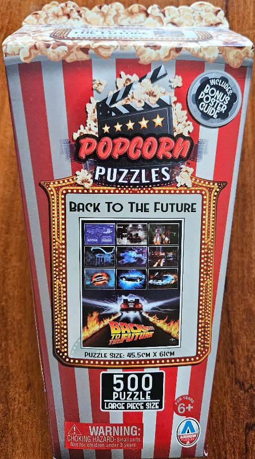 Back to the Future movie montage framed by a retro popcorn bucket graphic.