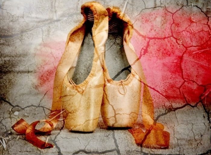 A pair of worn satin ballet slippers placed against a cracked, textured background with a wash of red color.