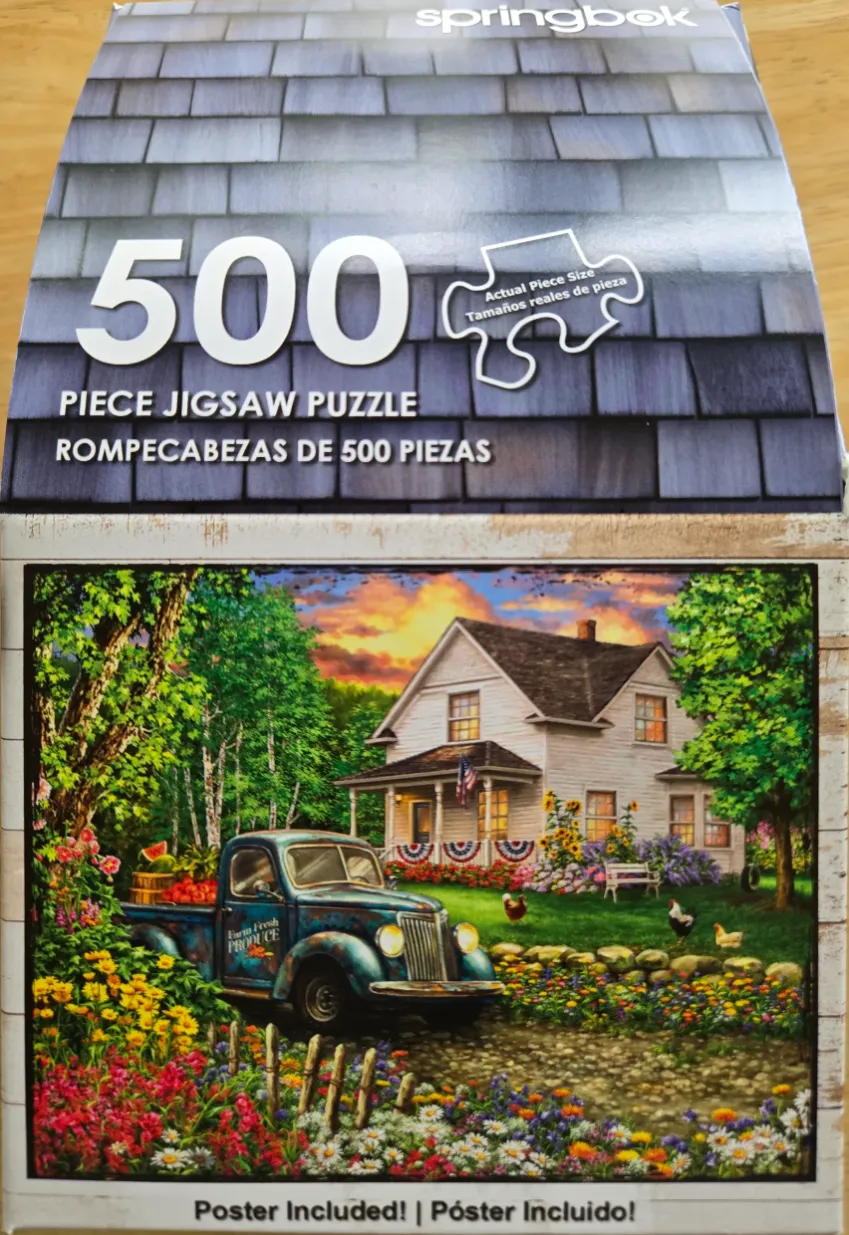 A countryside scene featuring a vintage blue pickup truck in front of a white farmhouse during sunset.
