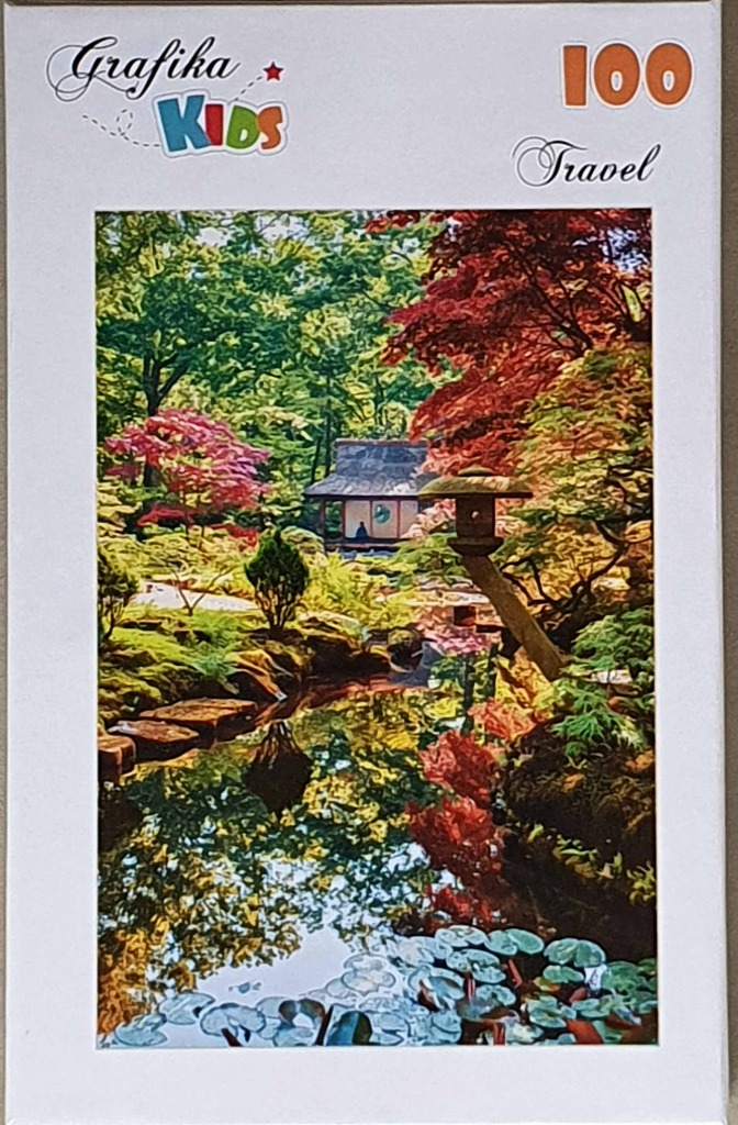A peaceful Japanese-style garden with a stone lantern, a reflective pond, and vibrant autumn maple trees.