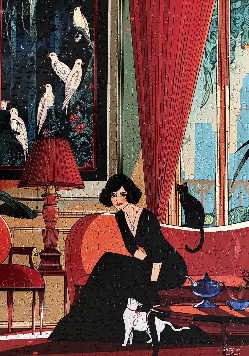 An elegant woman in a black dress sits on a red sofa in a room with a black cat, a white dog, and a bird-themed painting.