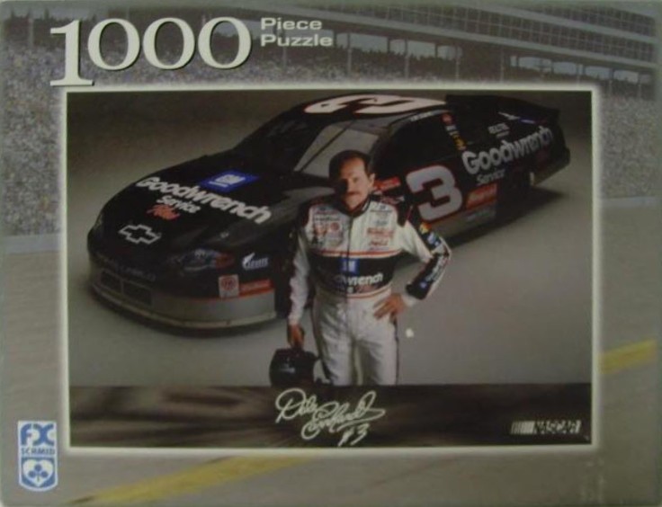 Dale Earnhardt standing in front of his black number 3 Goodwrench race car.