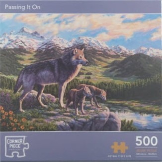 A wolf standing on a rocky outcrop with two cubs, overlooking a mountain valley landscape.