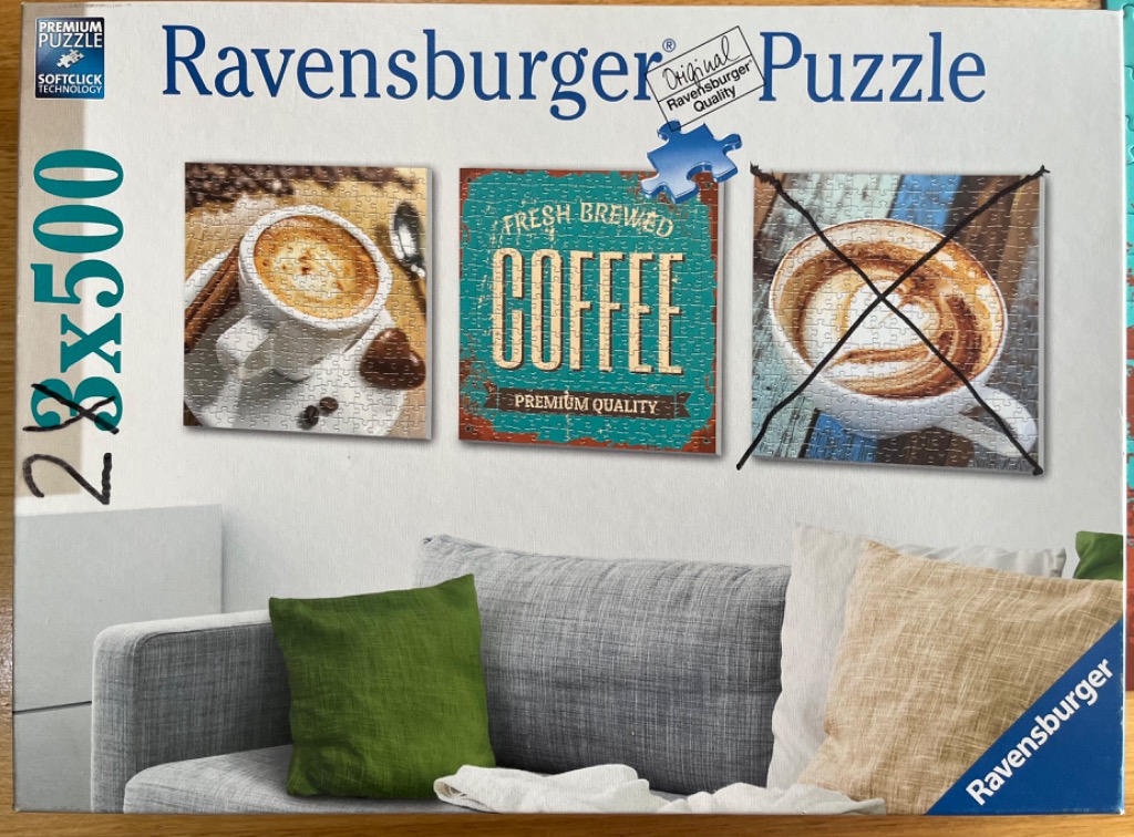 Three framed coffee-themed artworks displayed on a wall above a grey sofa.
