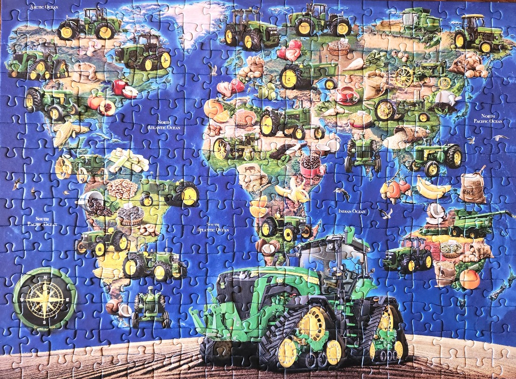 A world map illustration featuring green tractors and agricultural products overlaid on continents.
