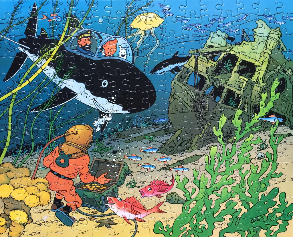 Tintin and Captain Haddock in a shark-shaped submarine exploring a shipwreck underwater.