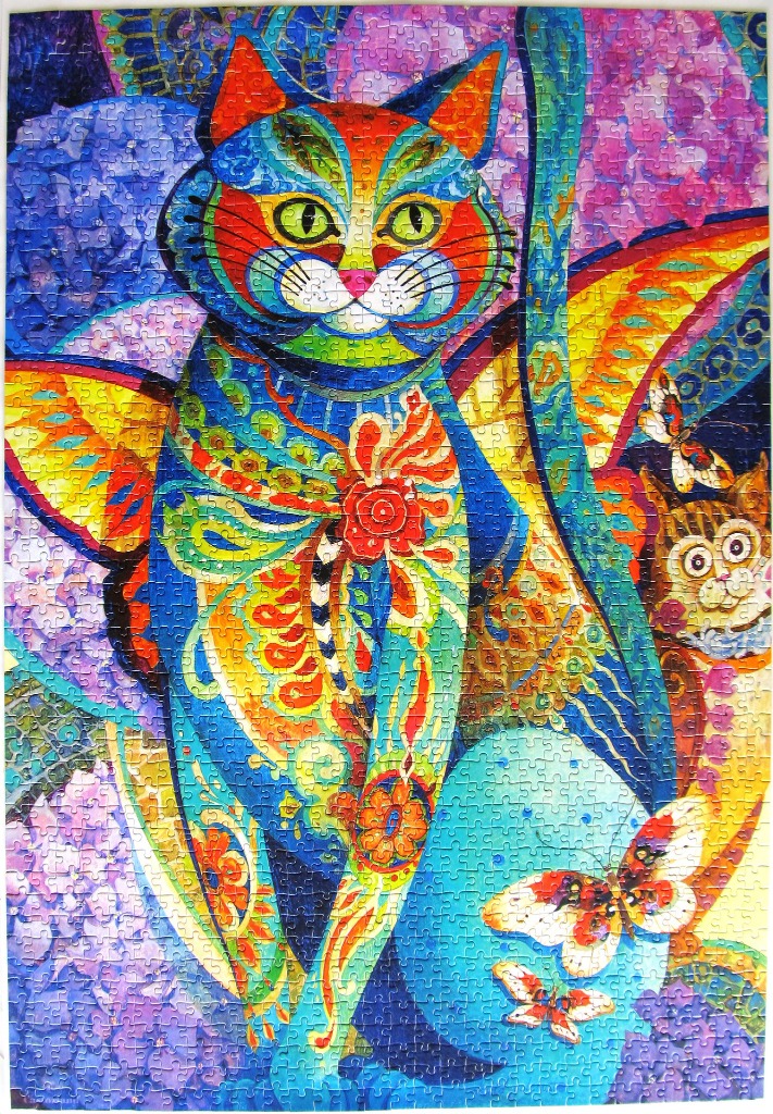 An artistic illustration of a stylized, colorful cat with butterfly wings and floral patterns.