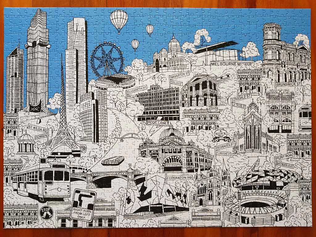Illustrated map of Melbourne featuring iconic city landmarks against a bright blue sky