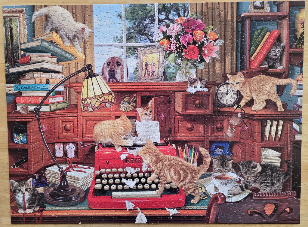 A detailed illustration of a cozy study filled with playful kittens interacting with a red vintage typewriter.