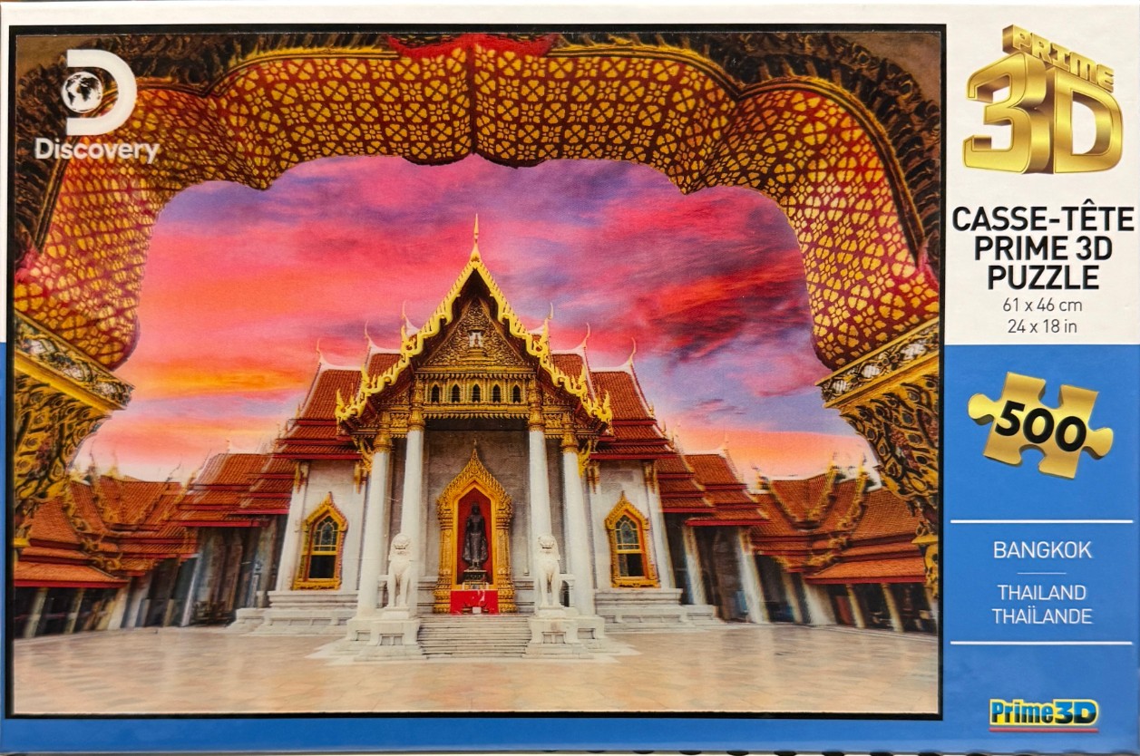 A view of the Marble Temple in Bangkok, Thailand framed by an ornate golden arch against a vibrant sunset sky.