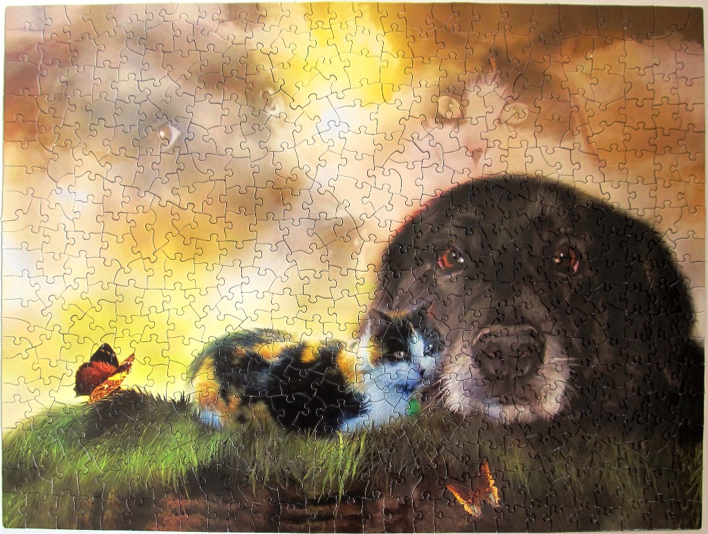 A black dog and a calico cat rest together in grass under a golden, ethereal sky with butterfly silhouettes.