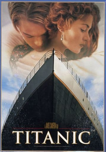 Film poster featuring a close-up of a young couple embracing behind the bow of the RMS Titanic ship.