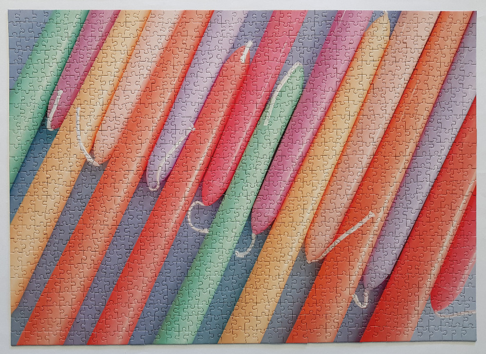 An abstract pattern of diagonal, brightly coloured, rounded balloon-like shapes