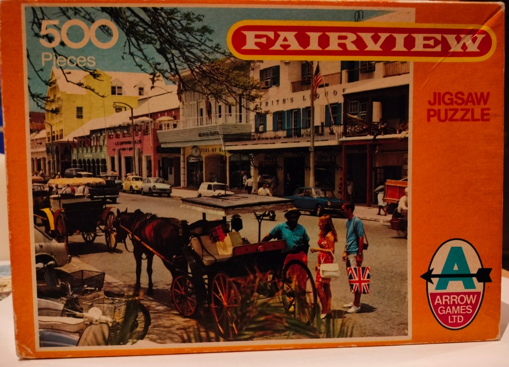 A vintage street scene in the Bahamas featuring horse-drawn carriages, colourful colonial buildings, and tourists.