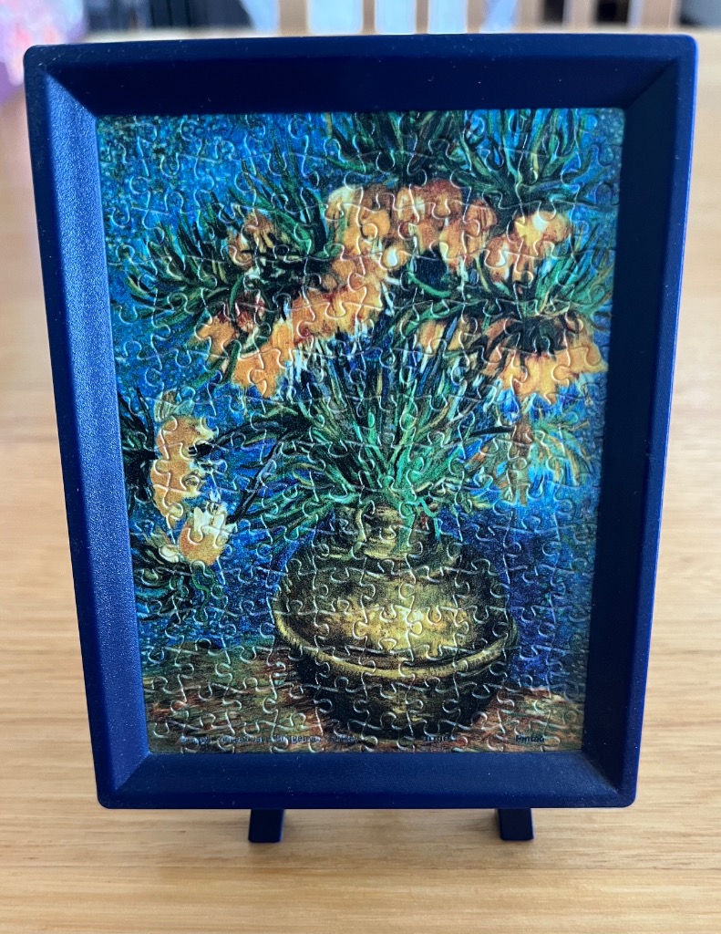 An expressionist-style still life painting of yellow sunflowers in a rounded vase against a dark blue textured background.