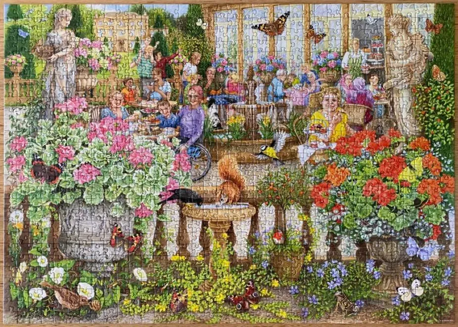 A lively outdoor cafe scene in a lush garden filled with flowers, people, and wildlife.