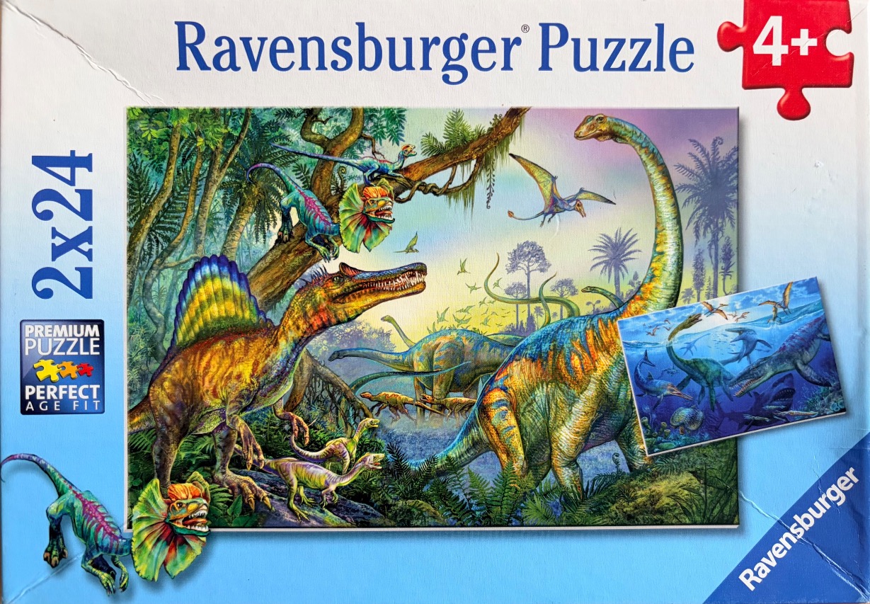 A vibrant illustration of various dinosaurs in a prehistoric jungle setting.