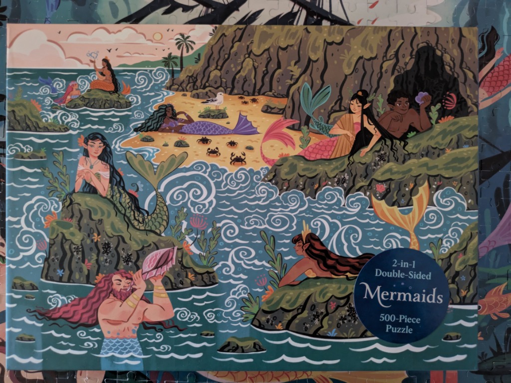 Illustration of several merfolk lounging on rocks and a sandy beach in a whimsical tropical setting.