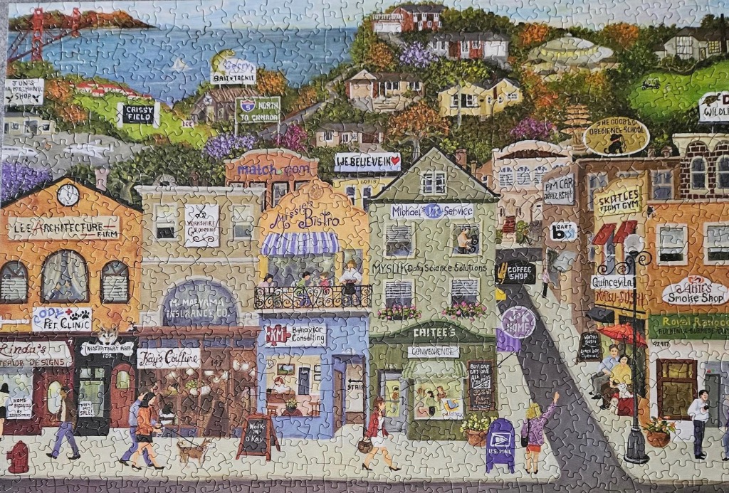 A whimsical illustration of a busy city street scene nestled against a hillside overlooking a bay.
