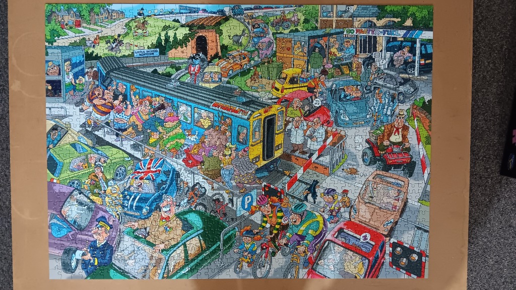 Humorous cartoon of a chaotic traffic jam with a crowded train and busy street scene.