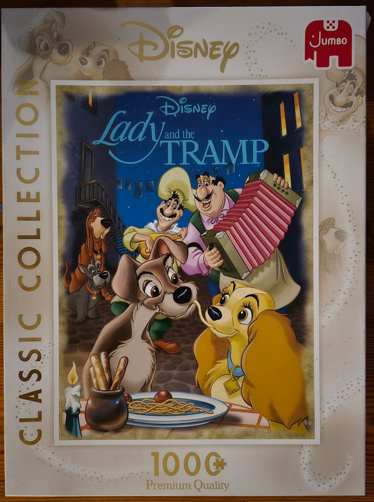 Classic Disney illustration of Lady and the Tramp sharing a spaghetti dinner with the Italian chef playing an accordion.