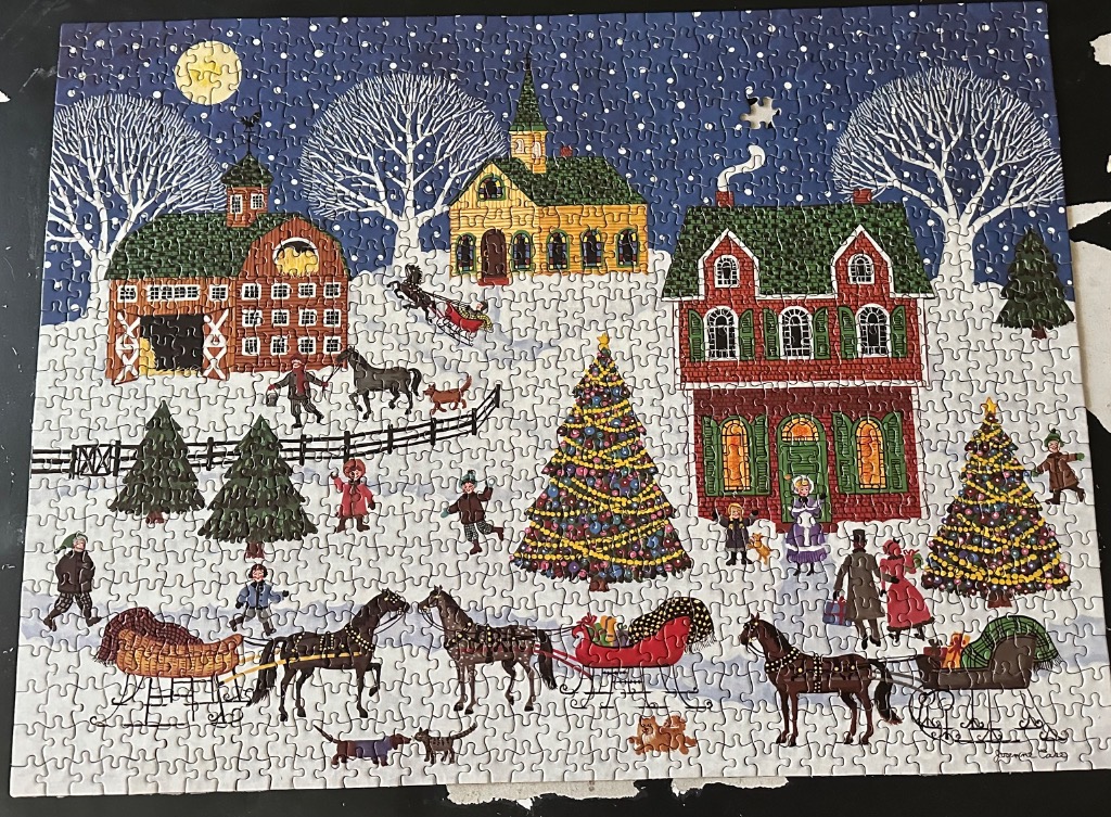 Folk art winter village scene featuring horse-drawn sleighs, decorated Christmas trees, and snowy buildings at night.