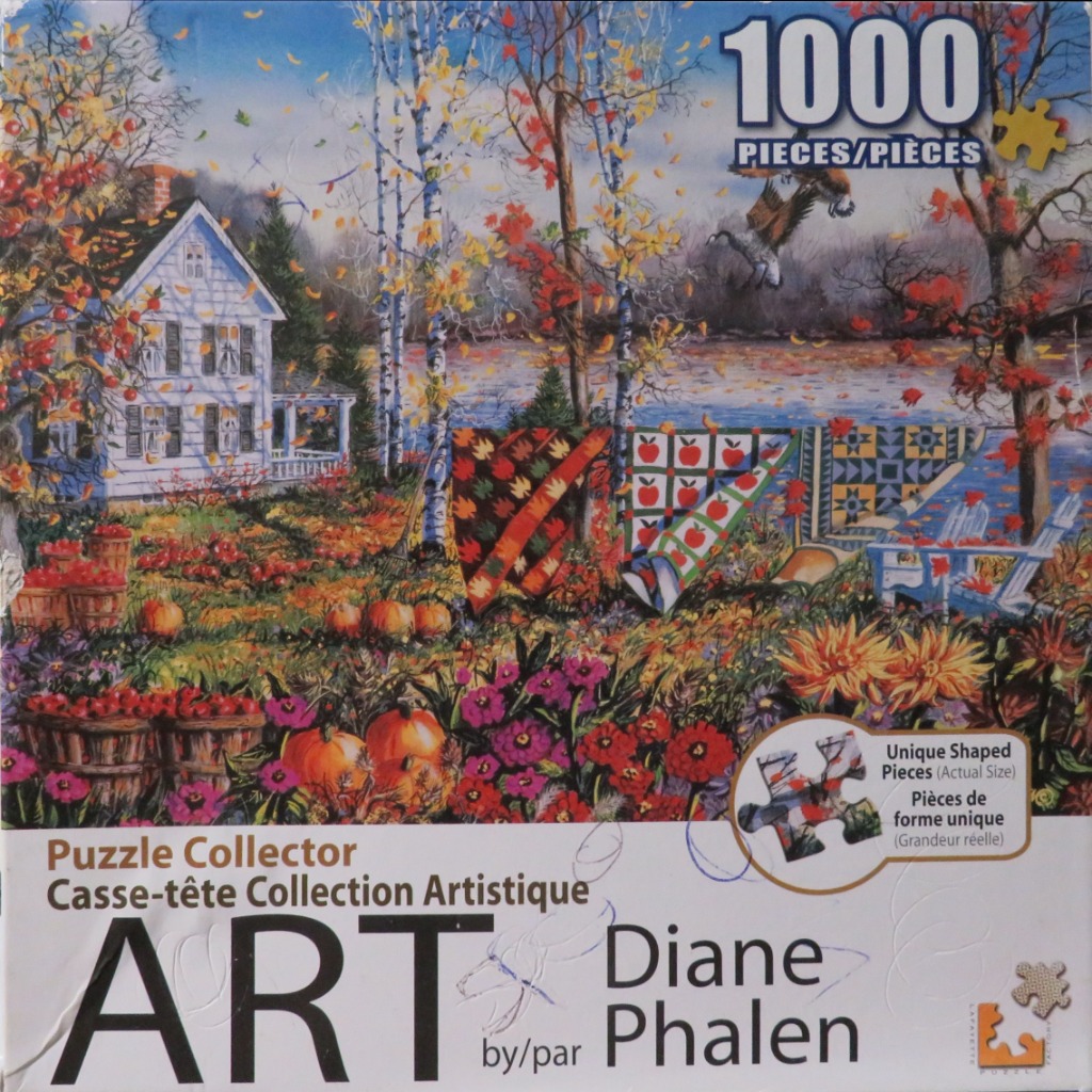 An autumn garden scene with a white house, quilts on a clothesline, and an eagle soaring over a lake.