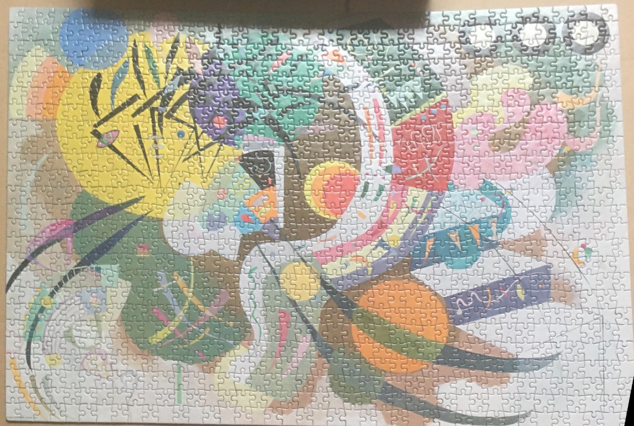 An abstract expressionist painting featuring vibrant geometric shapes and rhythmic lines in a chaotic composition.