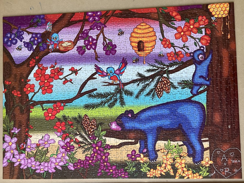 A whimsical illustration of a blue bear sleeping in a tree surrounded by bees, flowers, and birds at sunset.