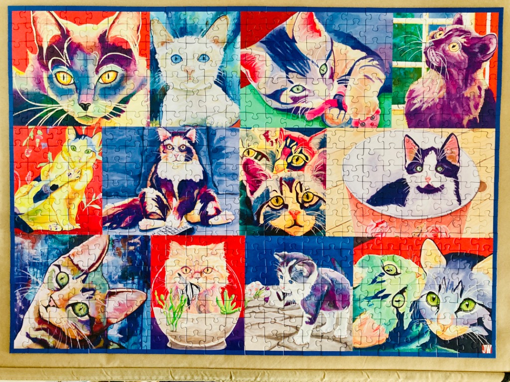 A collage of various colorful cat portraits in a grid format.