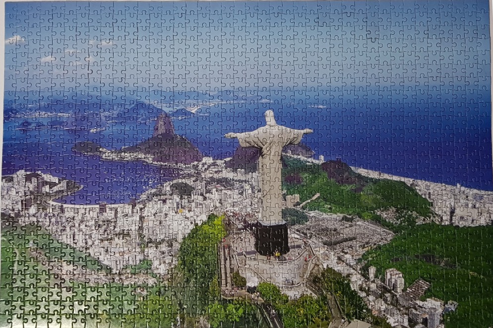 View of the Christ the Redeemer statue overlooking the city of Rio de Janeiro and Sugarloaf Mountain.