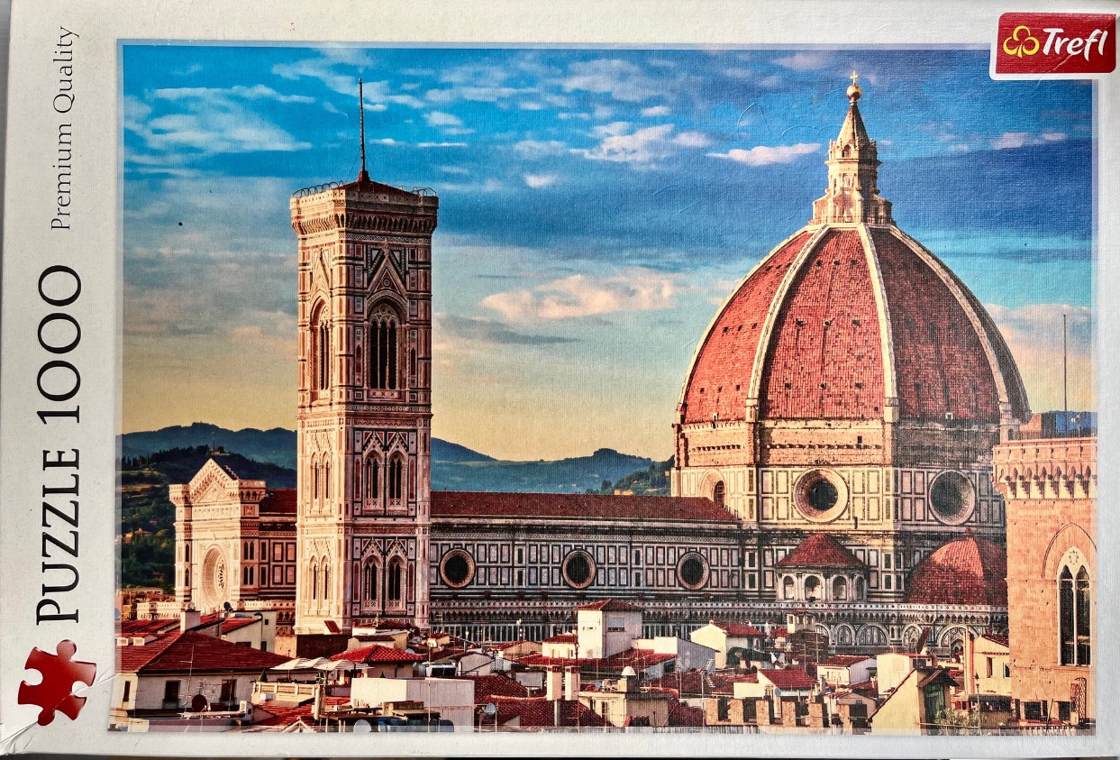 The Cathedral of Santa Maria del Fiore in Florence, Italy, under a blue sky at sunset.