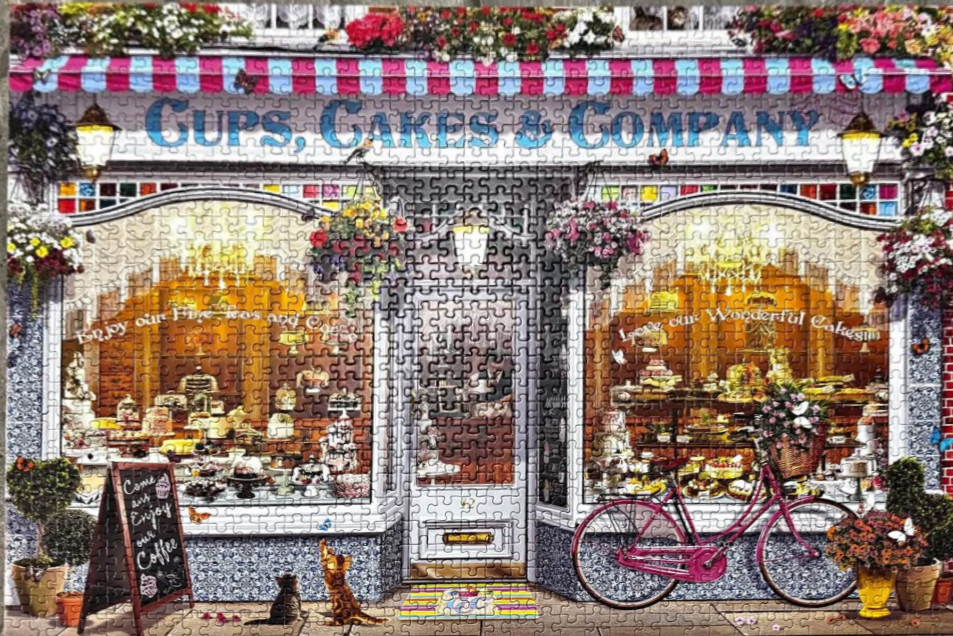 A charming illustrated storefront of a cafe named Cups, Cakes & Company with a pink bicycle and cats out front.