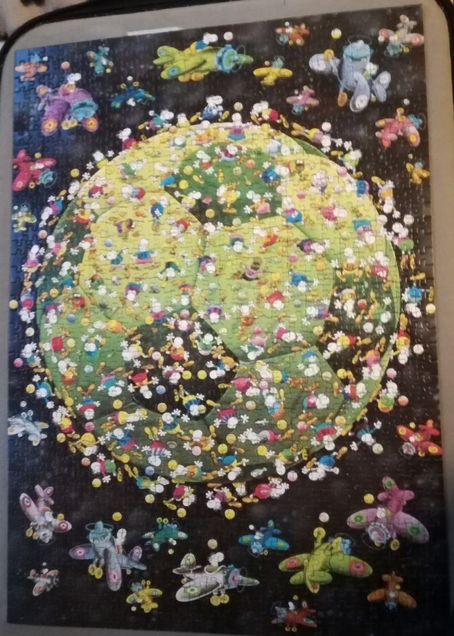 A cartoon illustration of a giant soccer ball floating in space, surrounded by many small, colorful airplanes.