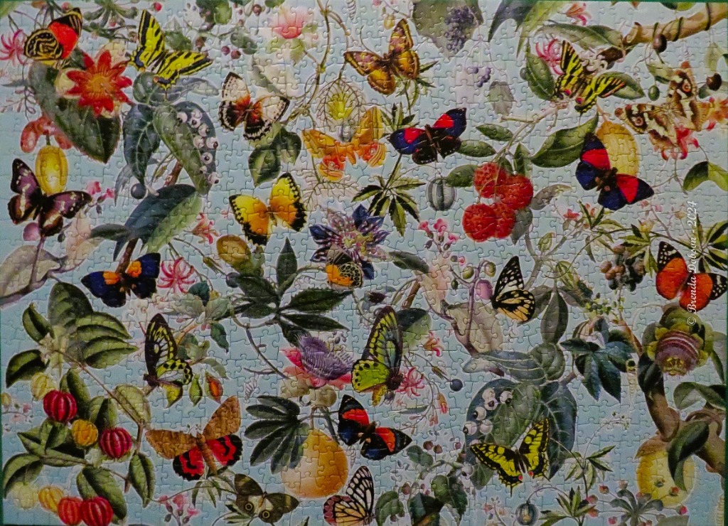 A lush botanical illustration featuring numerous vibrant butterflies and assorted fruits against a light blue background.
