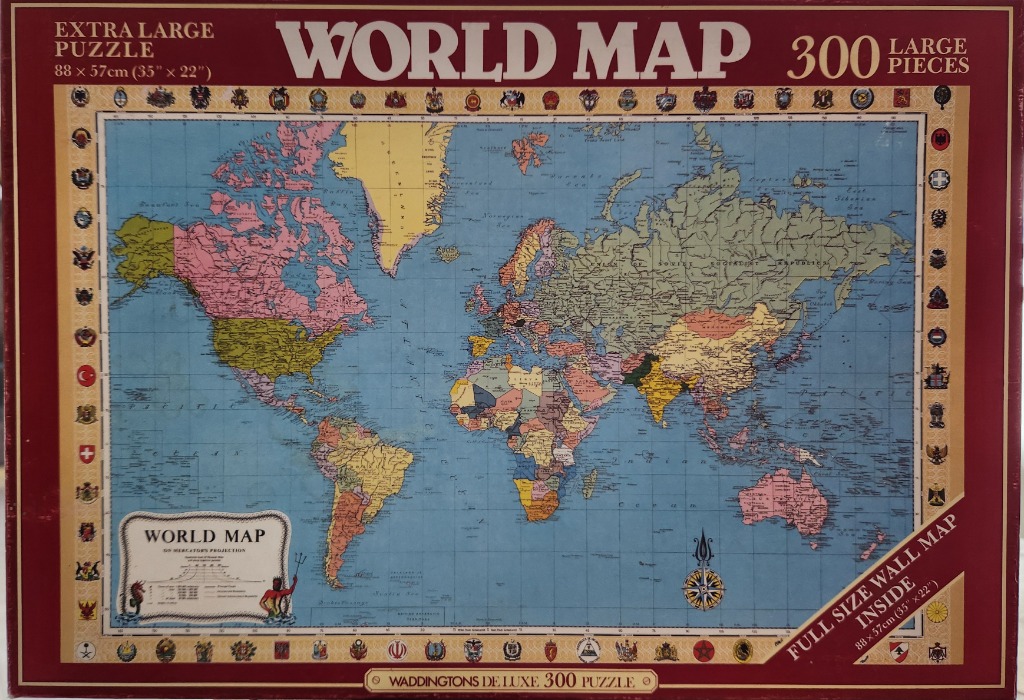 A vintage-style Mercator projection world map framed by a border of national flags and emblems.