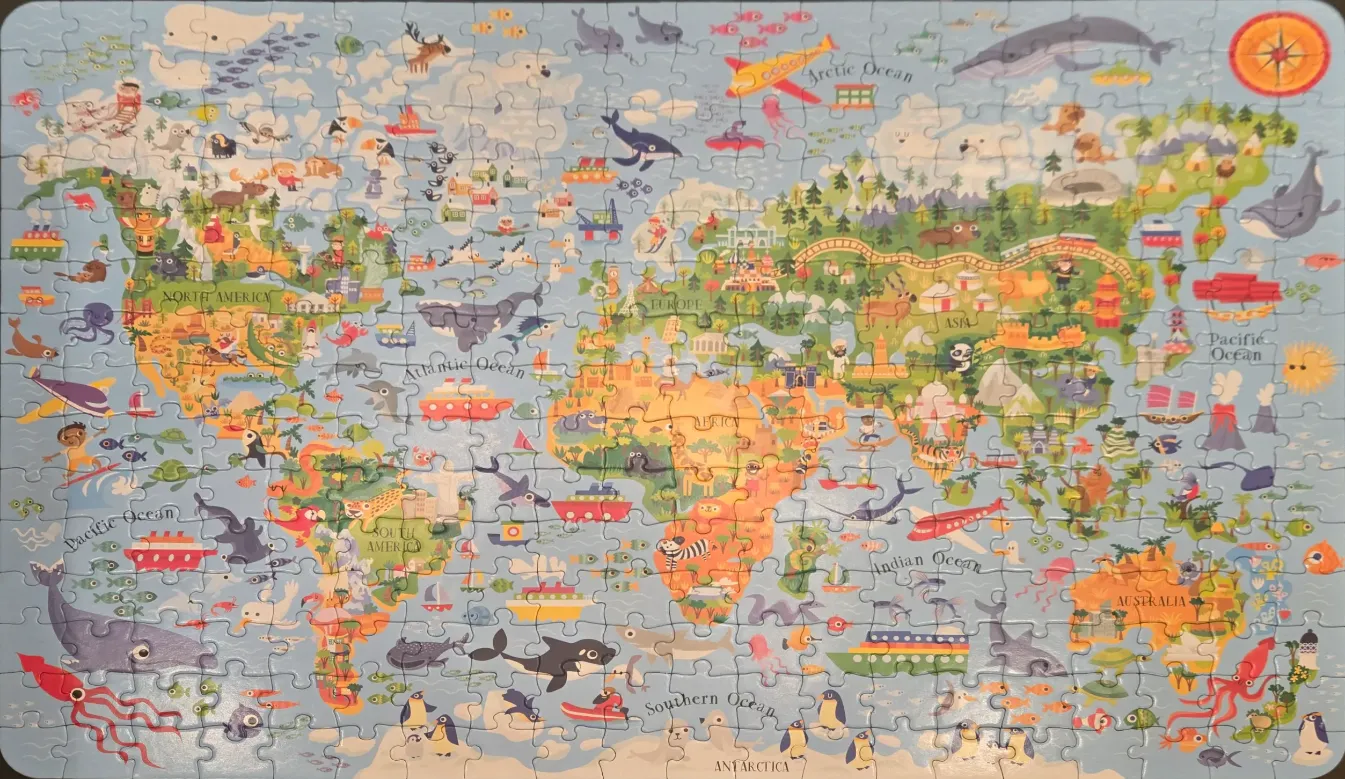 Illustrated world map for children featuring animals, landmarks, and ships on a light blue background.