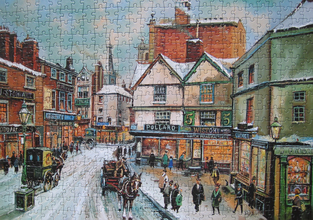 A nostalgic Victorian-era town street covered in a light dusting of snow with horse-drawn carriages and figures.