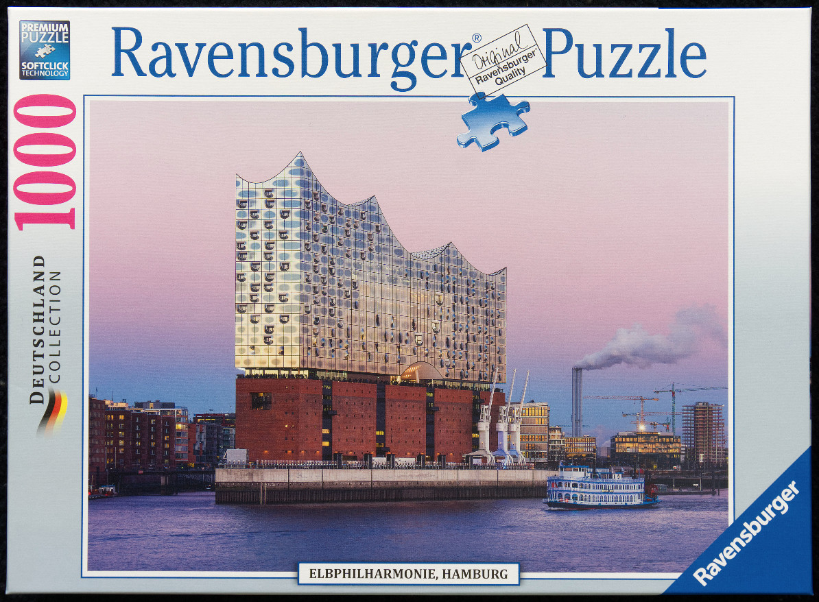 The Elbphilharmonie concert hall in Hamburg at twilight, seen from the Elbe river.