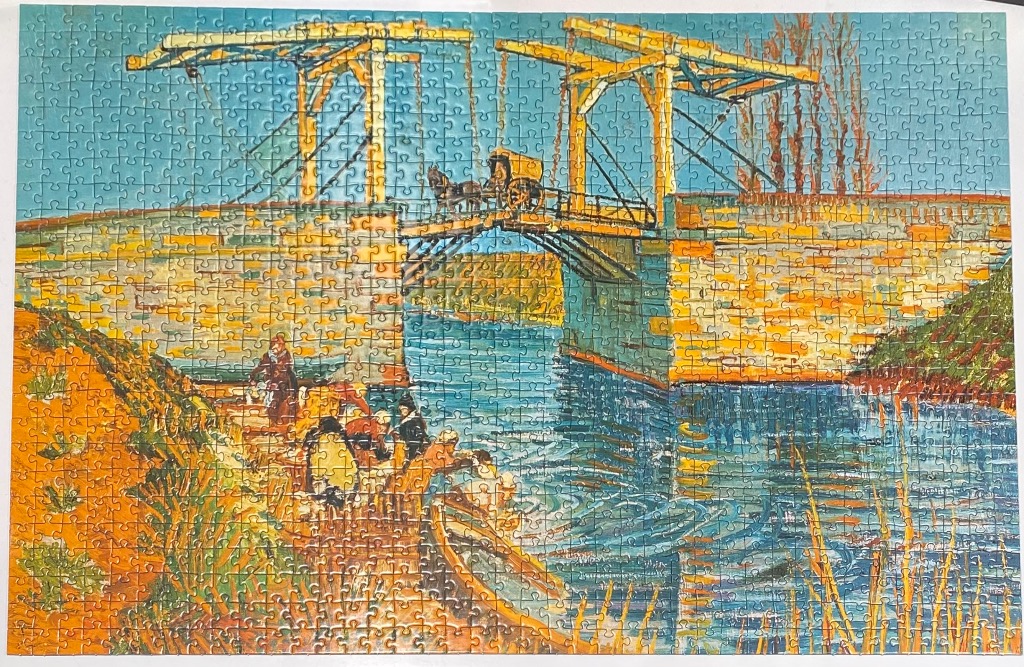 A post-impressionist painting of a wooden drawbridge over a canal with figures washing laundry at the water's edge.