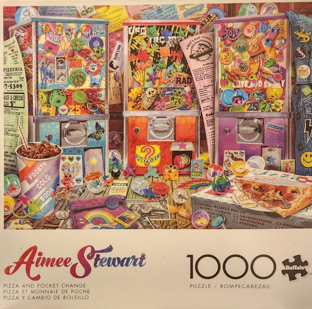 Three vintage gumball machines surrounded by pizza, soda, and retro trinkets on a wooden table.