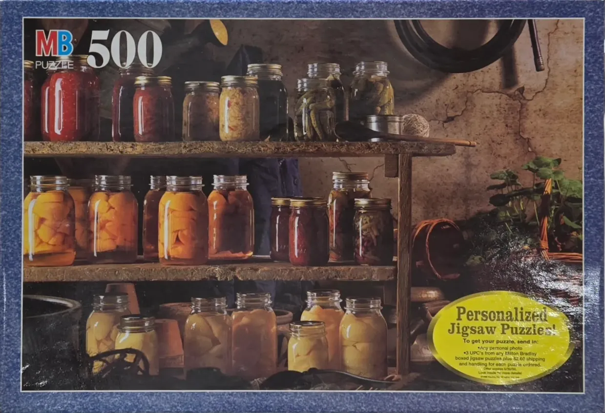 Close-up of rustic wooden pantry shelves filled with numerous glass canning jars containing various fruits and vegetables.